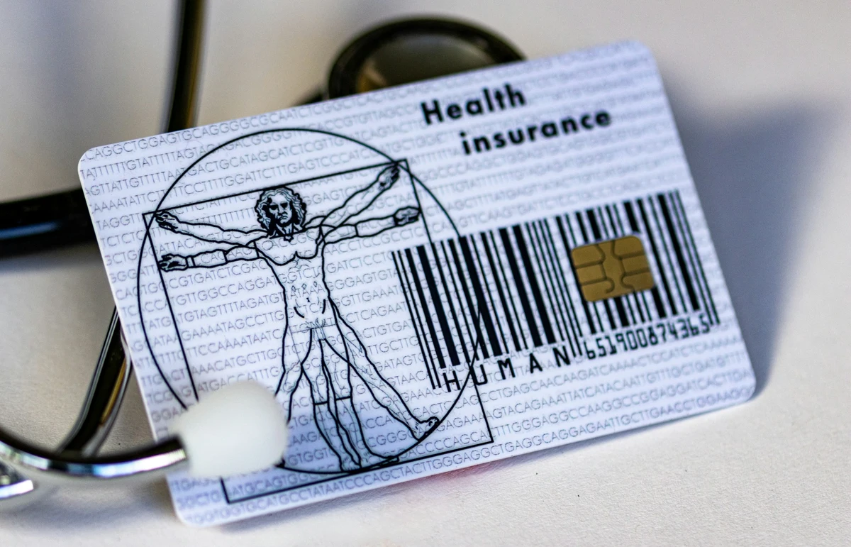 Health insurance card with a medical heartbeat line conceptual image
