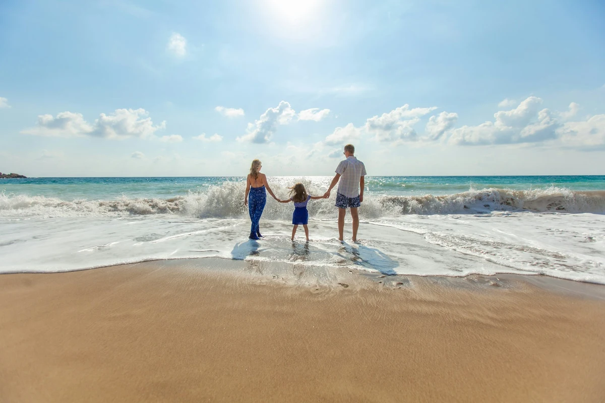 Family enjoying financial freedom and representative How to Build Wealth in Your 30s