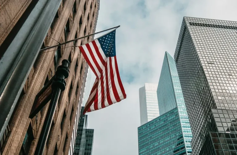 A building with an American flag, representing AI Jobs in the USA and technology growth across the country.