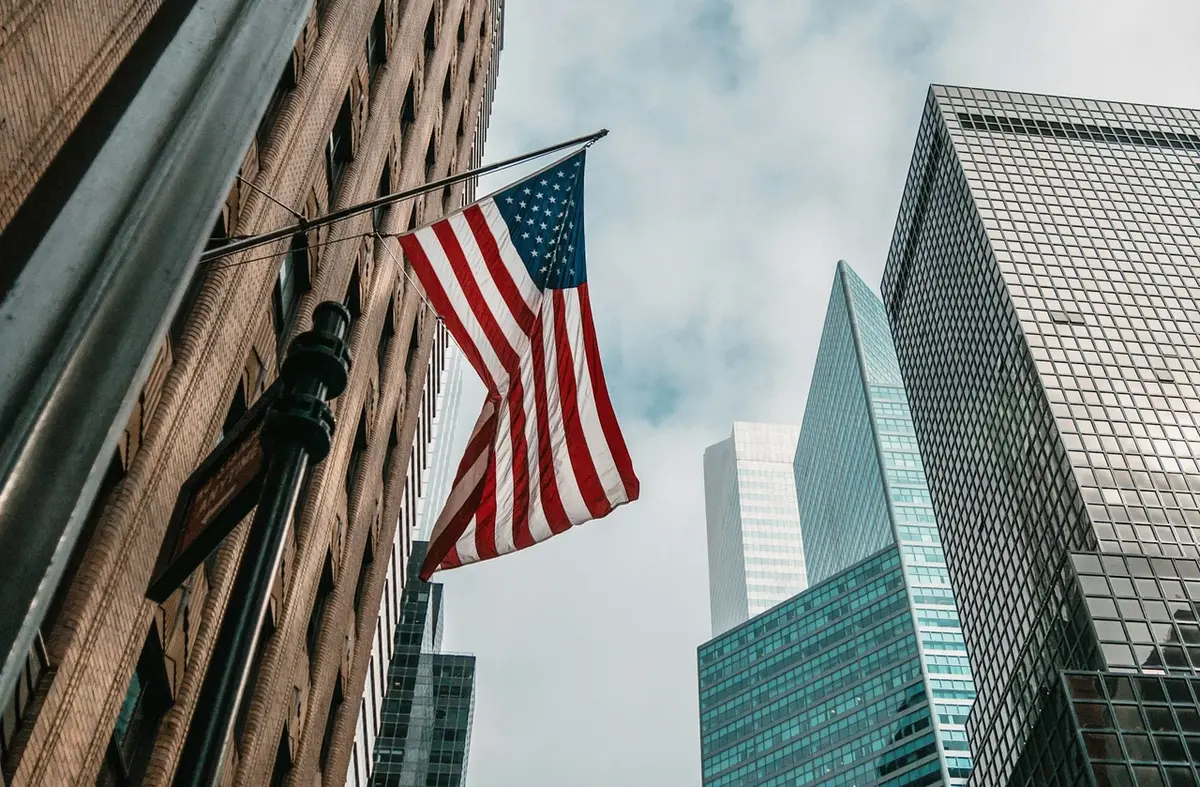 A building with an American flag, representing AI Jobs in the USA and technology growth across the country.