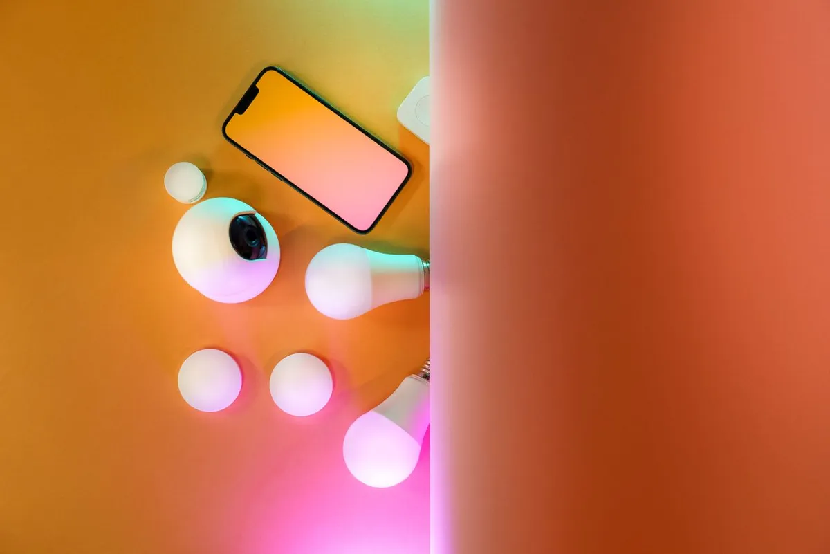 Person using a smartphone with colorful background, representing Best AI Tools for Small Business