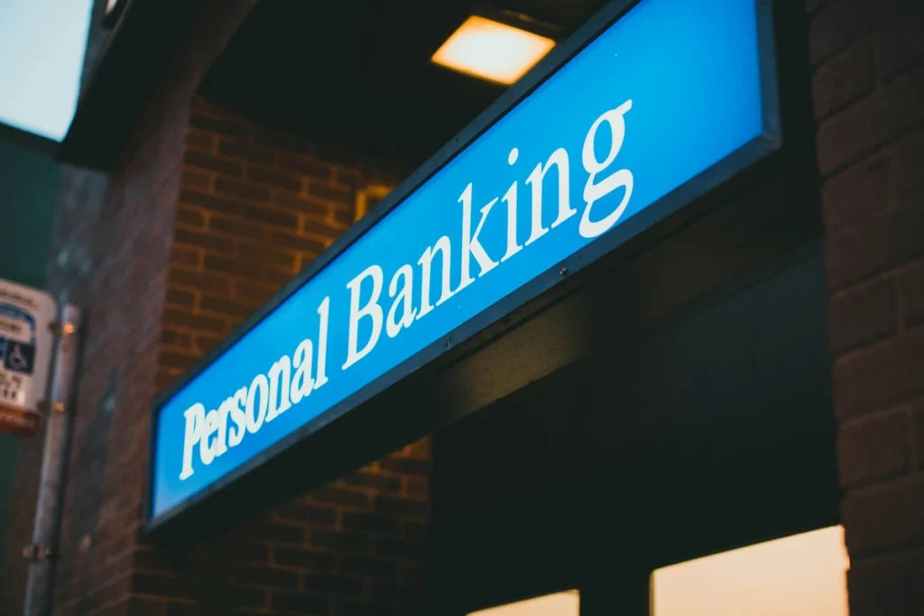 A blue "Personal Banking" sign on a modern building wall - What Is a Bank Account
