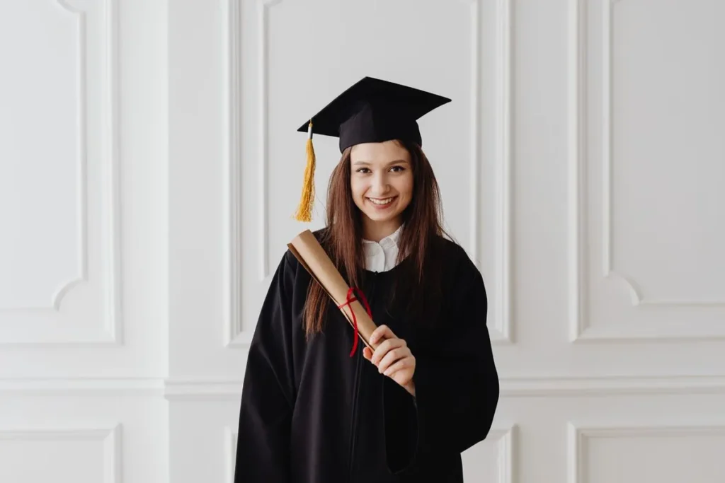 Female graduate with diploma symbolizing career options for AI Jobs Without Degree in USA 2026.