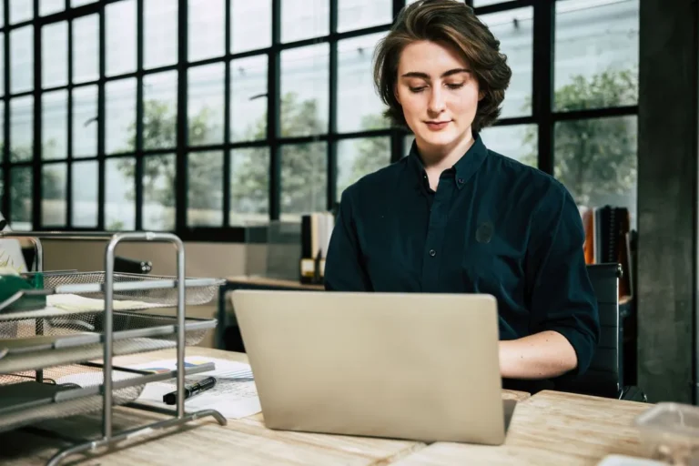 An image depicting the concept of "What Are Angel Investors," featuring a business professional seated and looking forward.