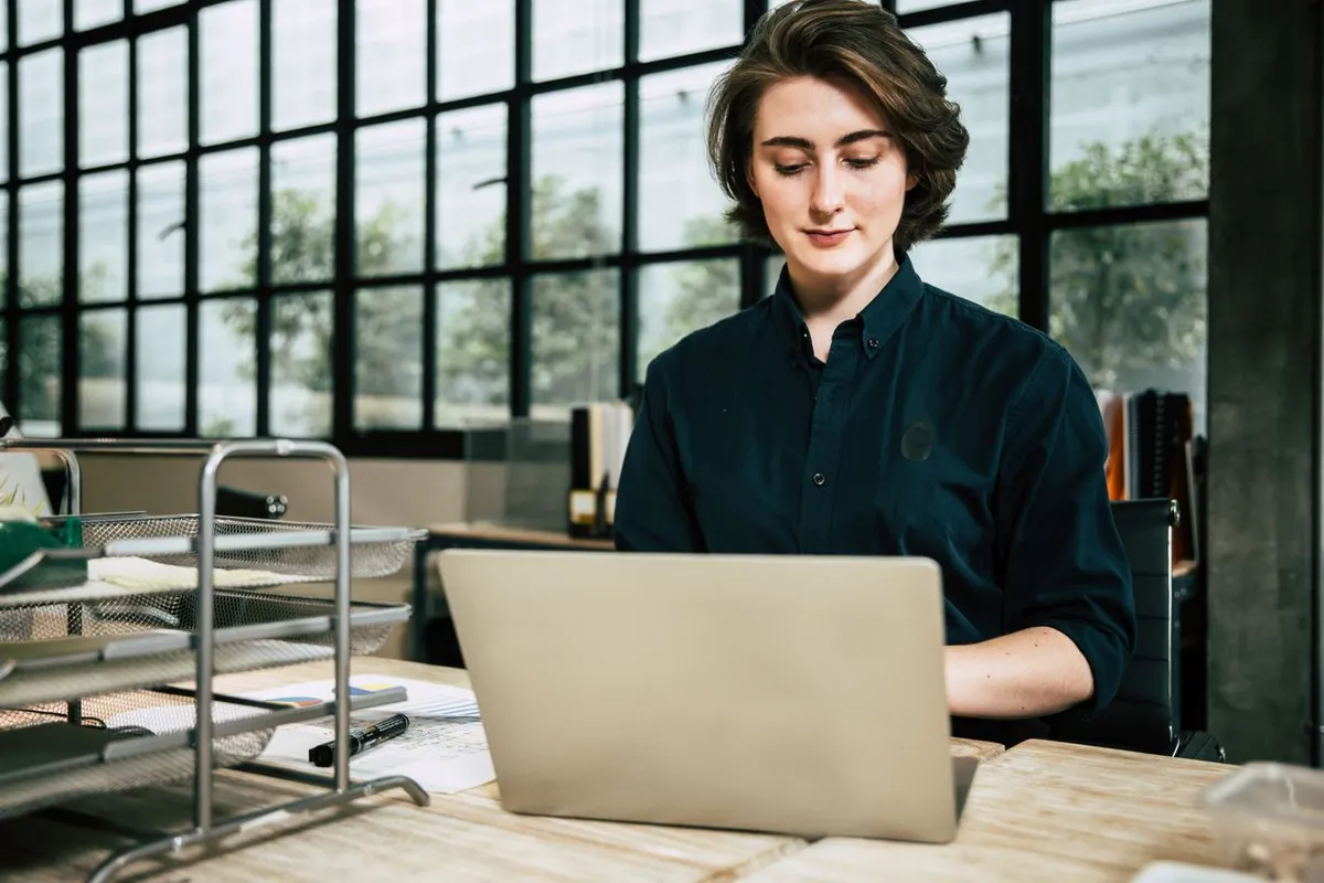 An image depicting the concept of "What Are Angel Investors," featuring a business professional seated and looking forward.