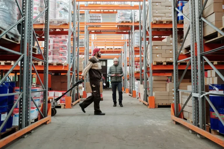 Logistics team packing products for shipping to show how What Is Supply Chain works in busines