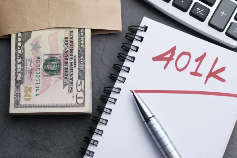 A notepad displaying 401k text next to cash and financial documents, explaining what is a 401(k) and workplace retirement plans.