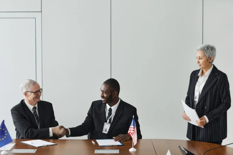 Business people having a meeting discussing international trade alliances in a office setting What Is a Trade Alliance