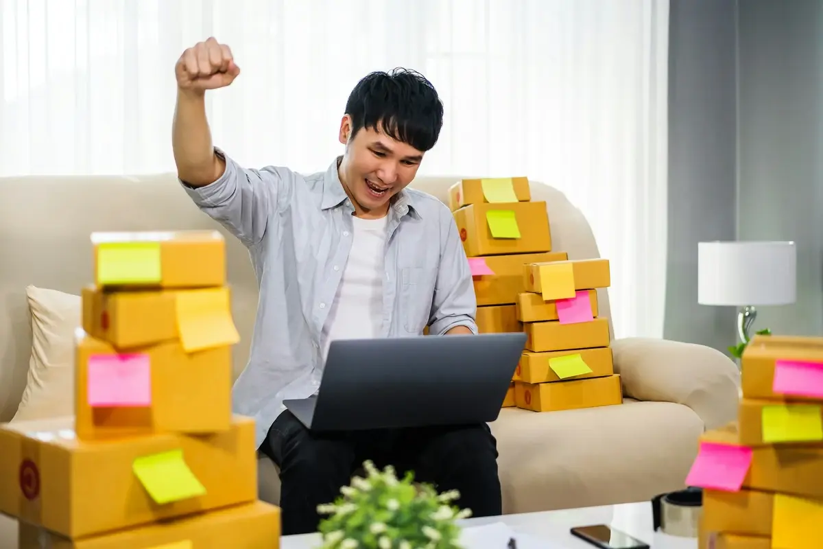 A young professional working productively on a laptop in a modern office - Most Profitable Small Business Ideas in the USA
