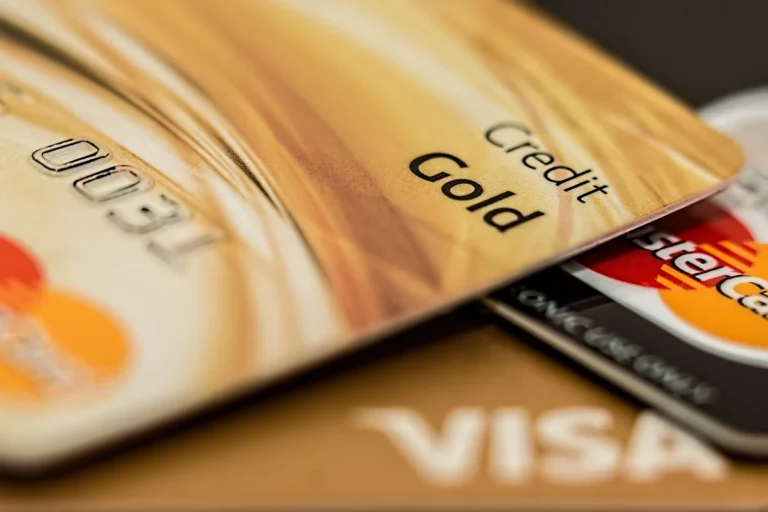Close-up of gold Visa credit cards — What Is a Credit Card