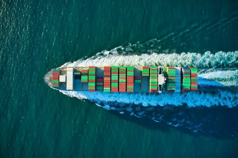 What Is Free Trade concept illustration with cargo ships and global trade routes