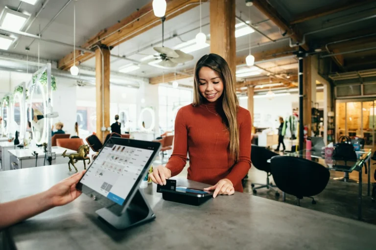 Small business team collaborating in a retail shop illustrating how to grow a small business
