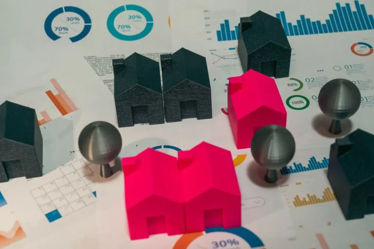 Best REITs for Beginners concept showing real estate models and investment tools