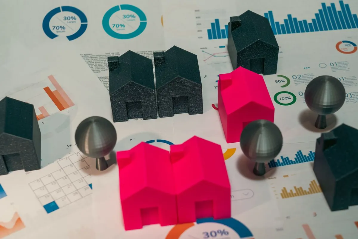 Best REITs for Beginners concept showing real estate models and investment tools