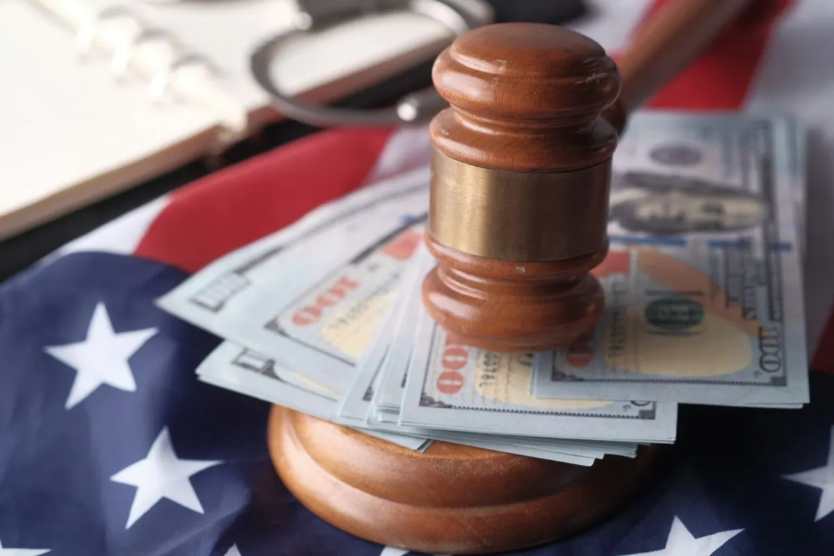 A judge gavel resting on financial ledger books, symbolizing authority and historical Fed decisions during past economic crises.