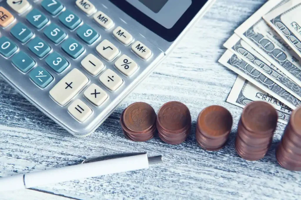 calculator on financial charts illustrating risk management in investing