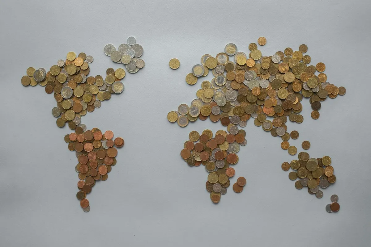 World map pinned on a wall, representing international trade, financial networks, and global connections for the article How Does the Global Economy Work?