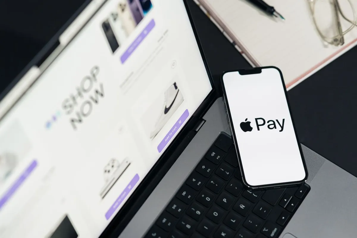 What Is Apple Pay? Smartphone displaying an Apple Pay contactless payment screen next to a physical credit card.