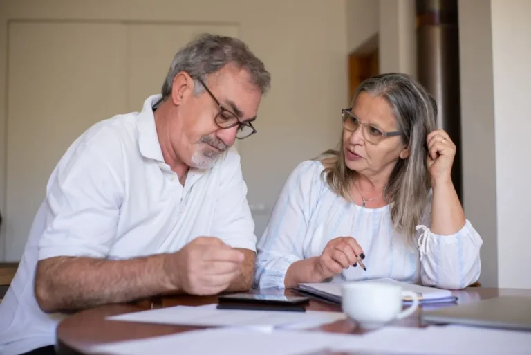 Best Roth IRA Investments: Senior couple reviewing their retirement planning and investment options on a laptop.