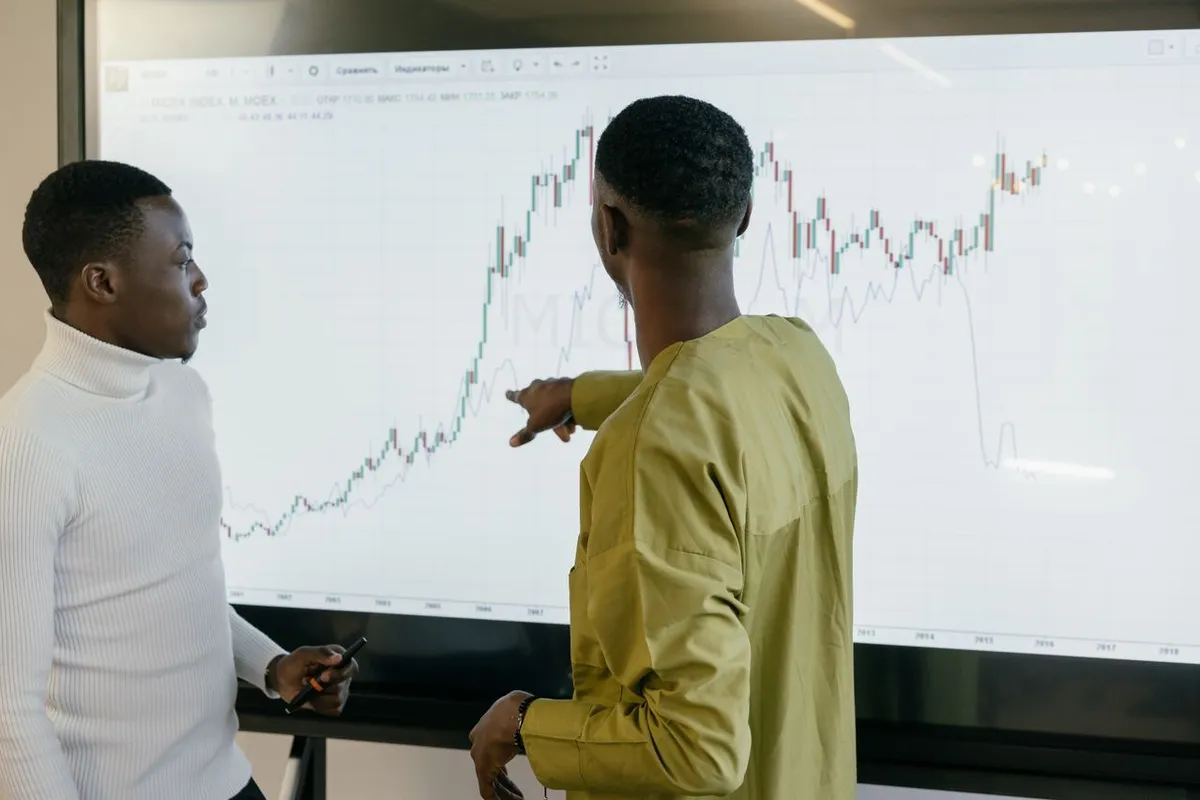An investor studying market trends and economic data to understand how does the economy work.
