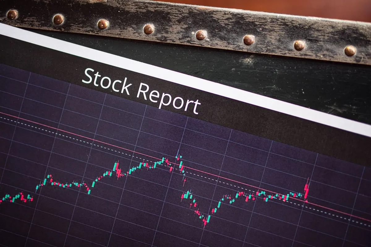 A financial newspaper with a Stock Report headline alongside stock market charts, representing Best Growth Stocks and Best Value Stocks 2026.